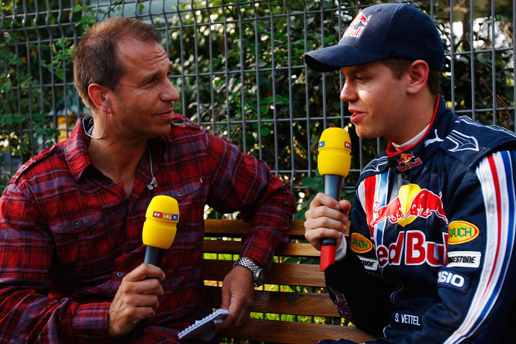 Formel 1 Kai Ebel mit Sebastian Vettel